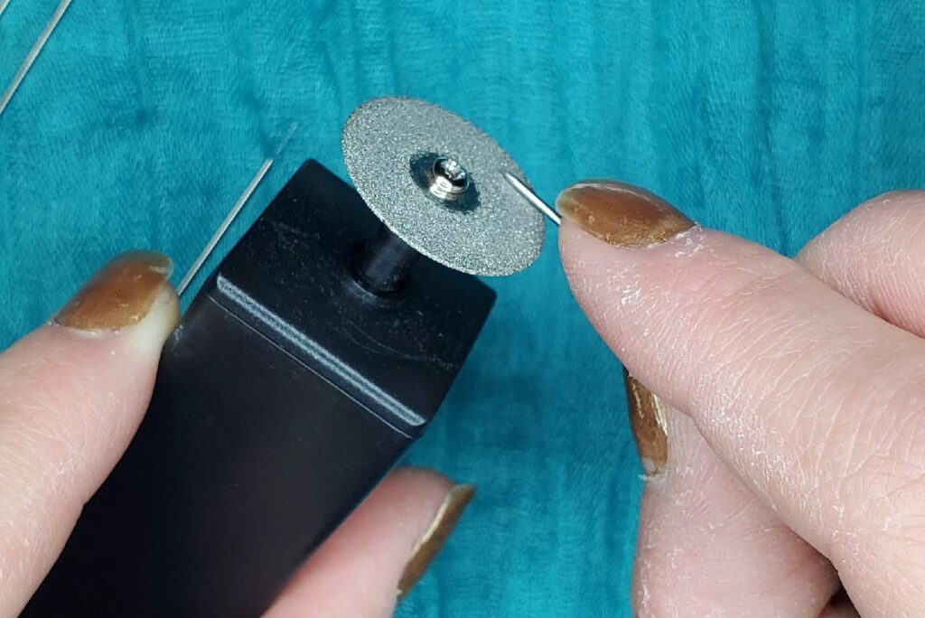 hands sharpening permanent jewelry tungsten electrodes