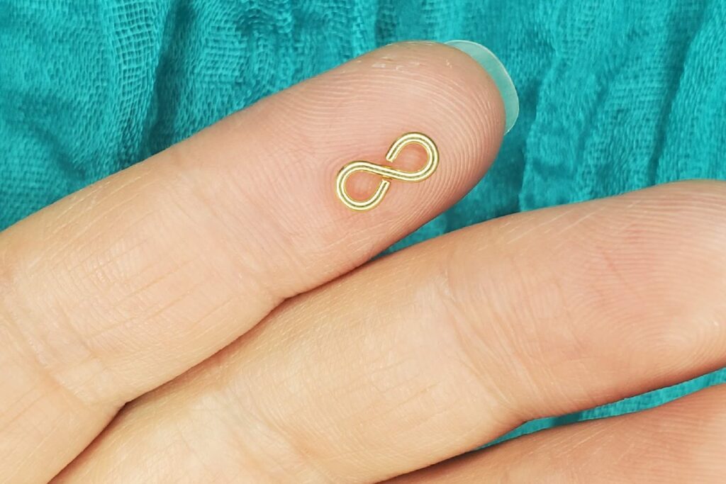 infinity permanent jewelry charm