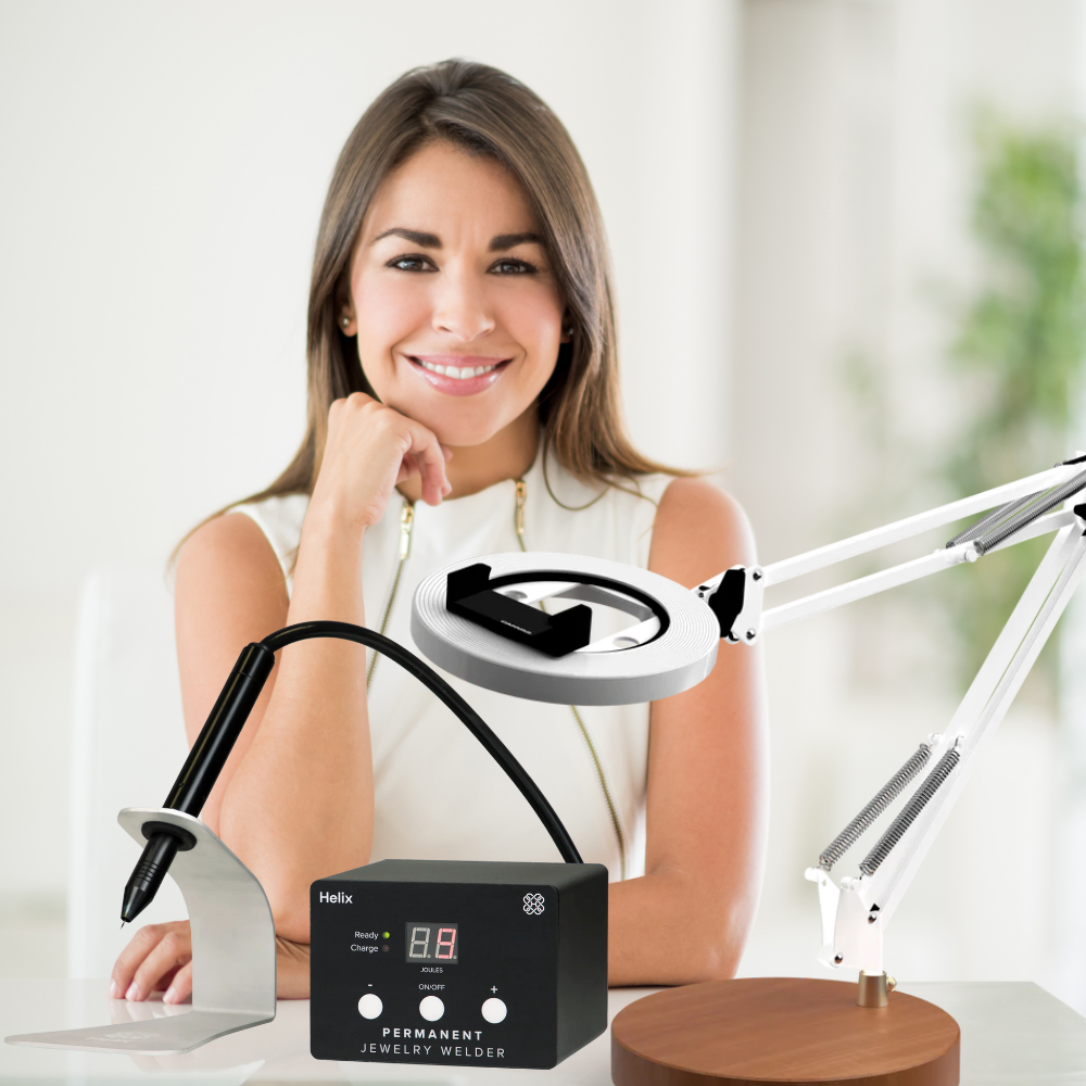 permanent jewelry artist smiling with welder and Canvas lamp
