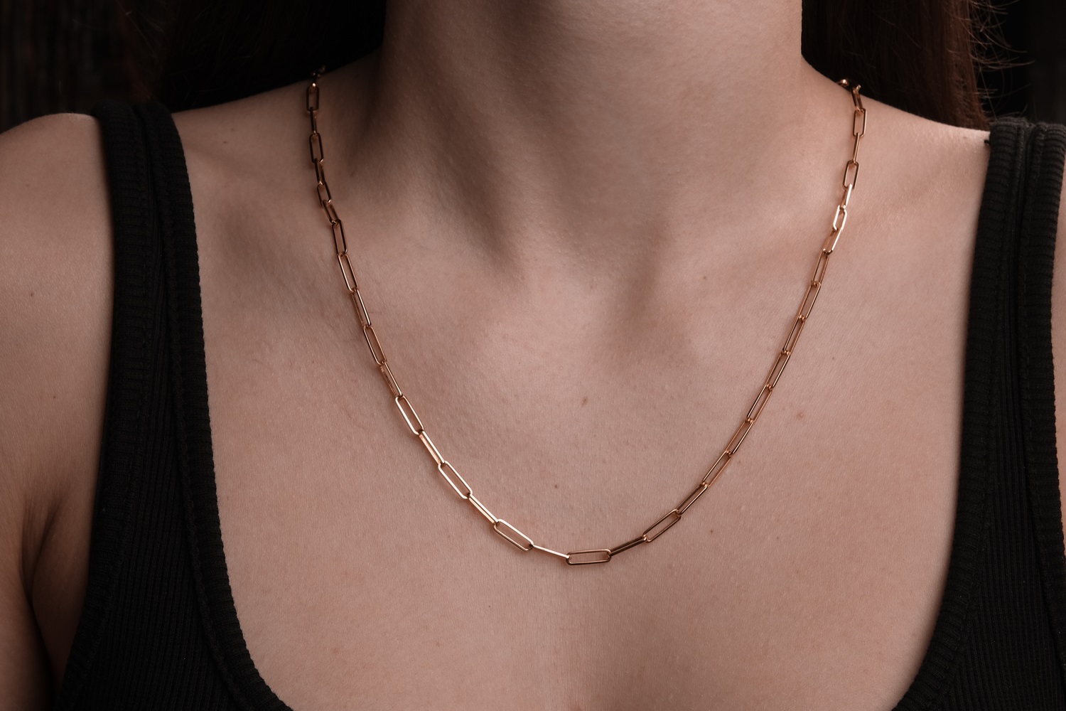 woman wearing durable gold permanent jewelry necklace