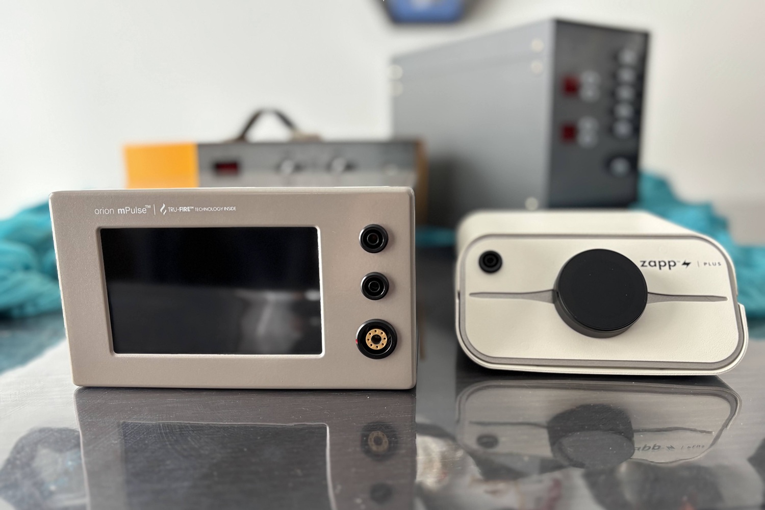 four permanent jewelry welders on a table