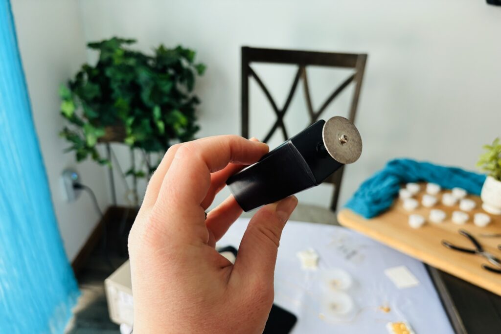 Trinity holding a diamond plated electrode sharpener