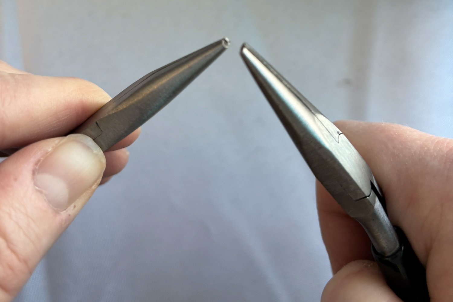 permanent jewelry pliers closing a jump ring