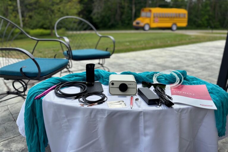 permanent jewelry business with bus pulling away in background