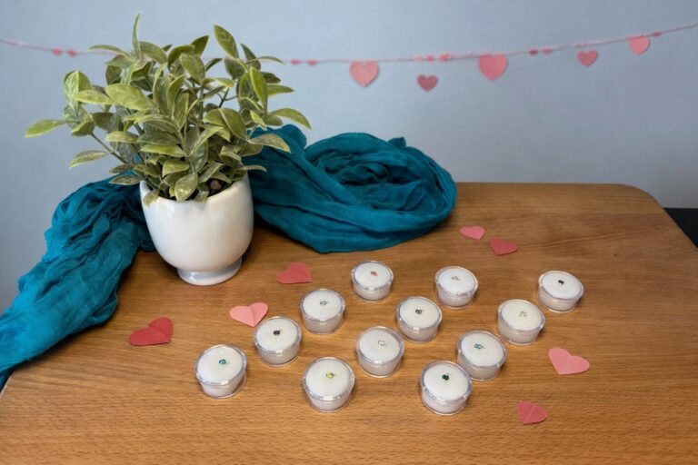 Valentine's Day permanent jewelry charms on a table