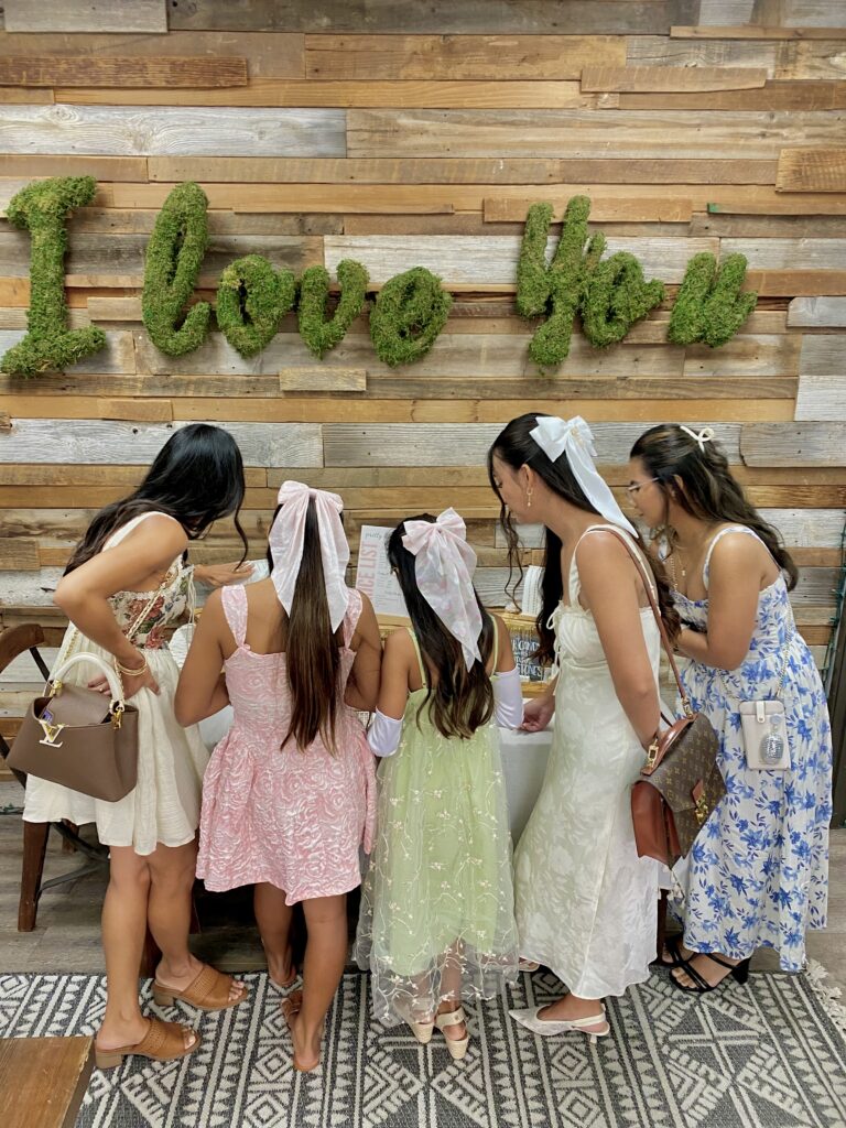 mothers and daughters selecting permanent jewelry
