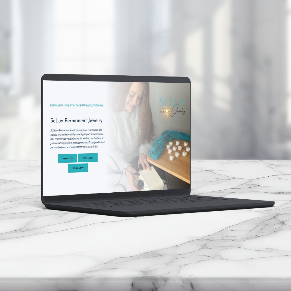 laptop displaying permanent jewelry artist profile on a countertop